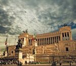 Stunning view of the Victor Emmanuel II Monument in Rome under dramatic skies.